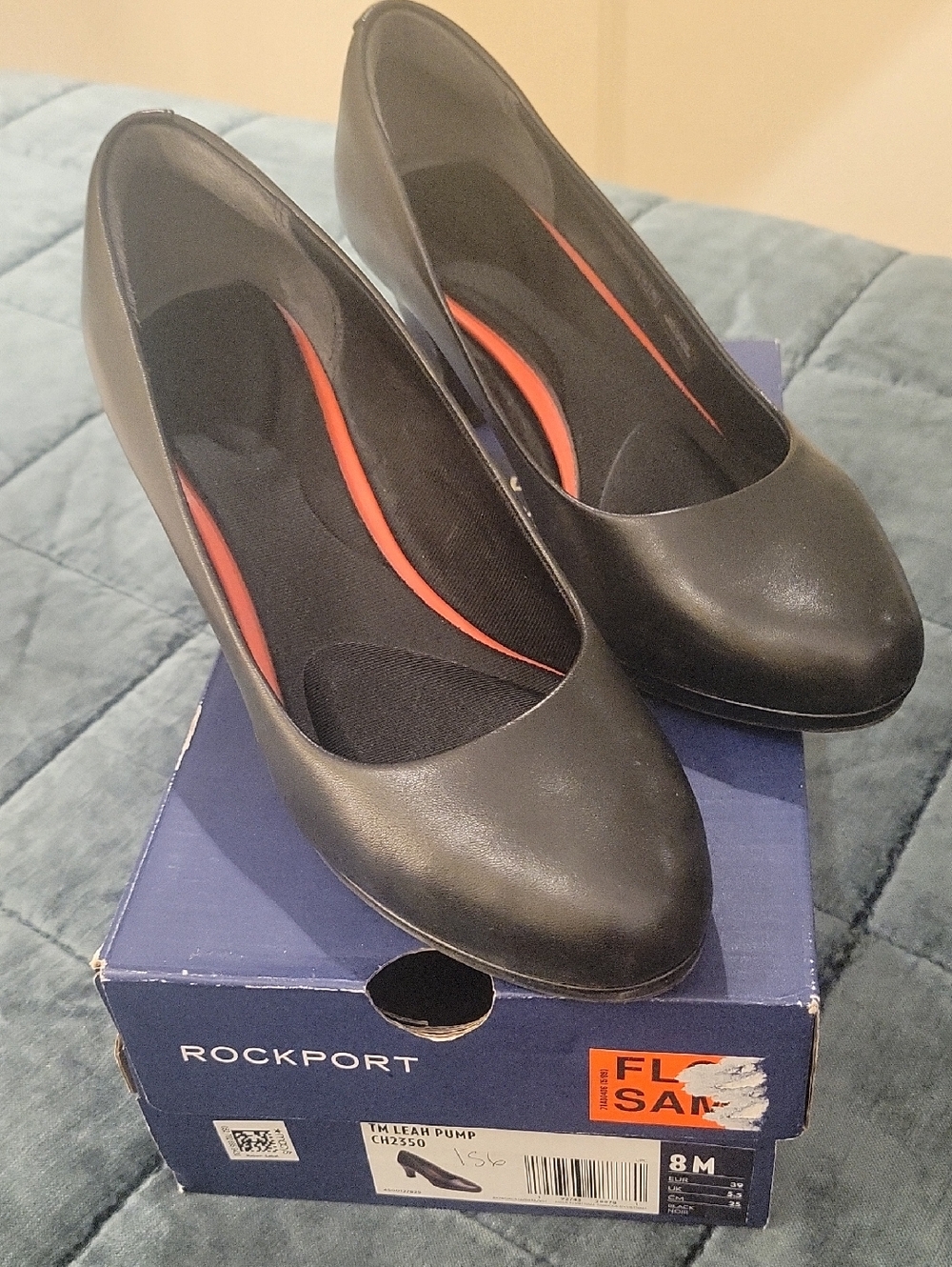 Rockport Black Round-Toe Pumps with Subtle Red Insole Accents